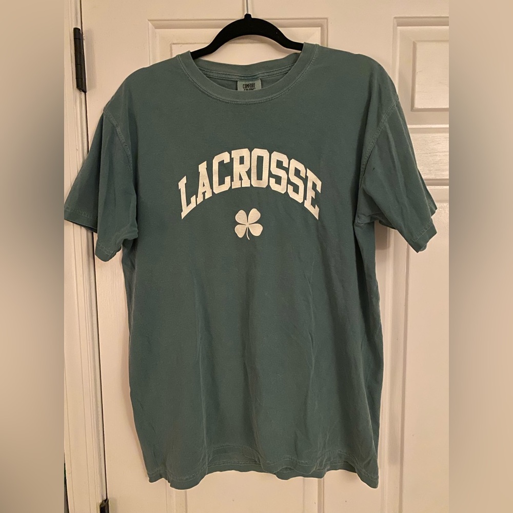 Green women’s lacrosse shirt